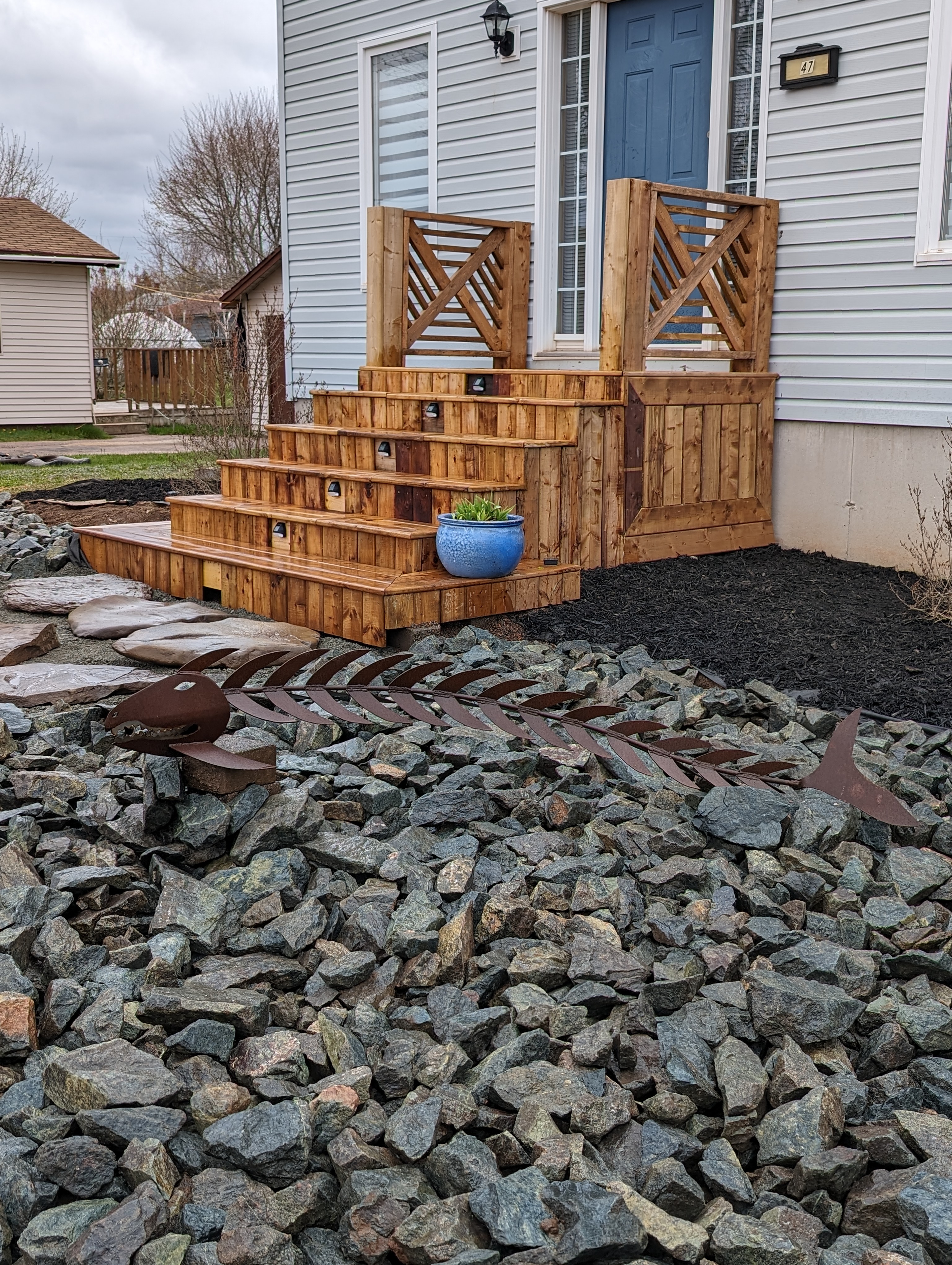 Wood steps with a custom inlay railing design.